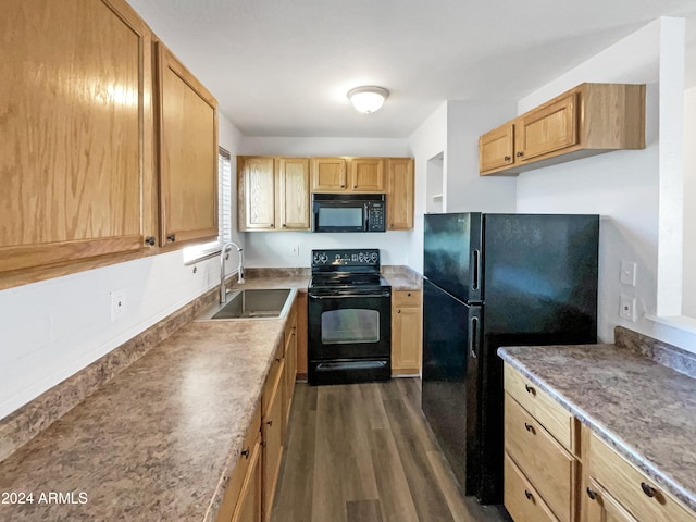 kitchen with black appliances, sink, and dark wood-type flooring