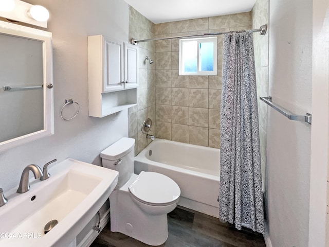 full bathroom with shower / bath combo, wood-type flooring, sink, and toilet