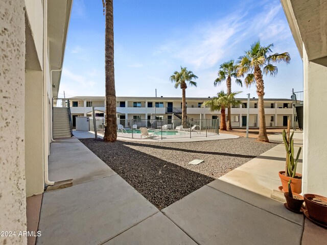 exterior space with a pool and a patio area