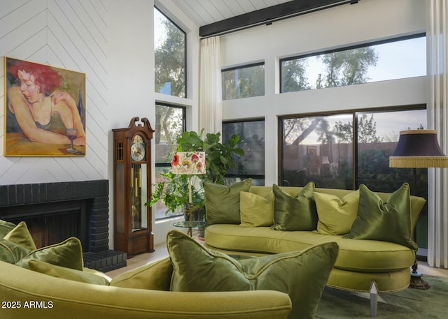 sunroom with a brick fireplace