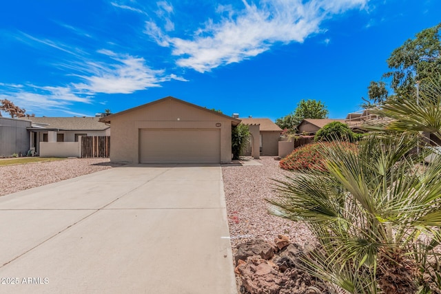 5237 W Mountain View Rd, Glendale, AZ 85302 - view of front facade with an attached garage, stucco siding, driveway, and fence