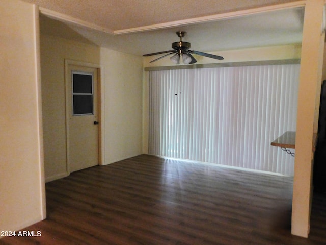 unfurnished room with ceiling fan, dark hardwood / wood-style floors, and a textured ceiling