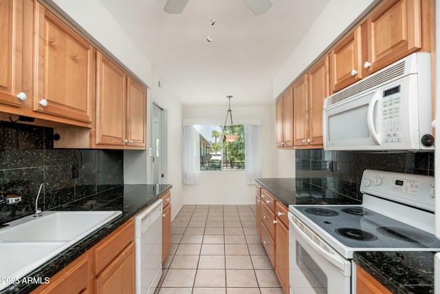330 W Maryland Ave Unit 207, Phoenix, AZ 85013 - kitchen with white appliances, backsplash, tile counters, and light tile patterned floors