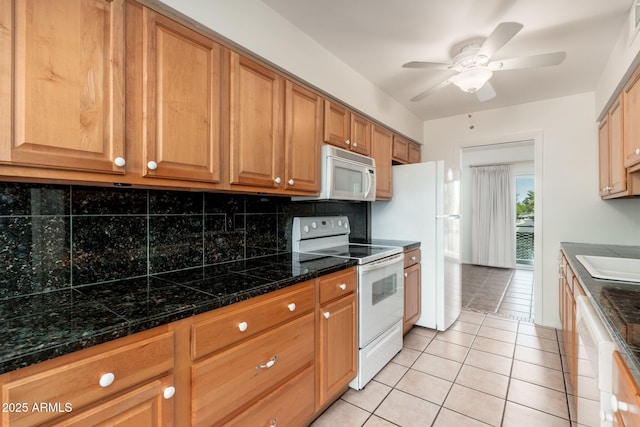 330 W Maryland Ave Unit 207, Phoenix, AZ 85013 - kitchen with white appliances, tasteful backsplash, ceiling fan, light tile patterned floors, and tile counters