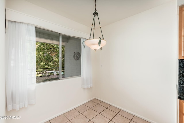 330 W Maryland Ave Unit 207, Phoenix, AZ 85013 - unfurnished dining area with light tile patterned floors and baseboards