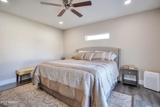 bedroom featuring a ceiling fan, recessed lighting, baseboards, and wood finished floors