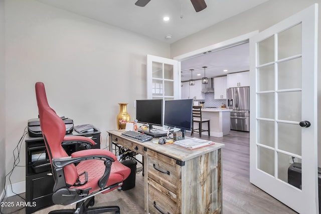 home office with recessed lighting, a ceiling fan, and light wood-style floors