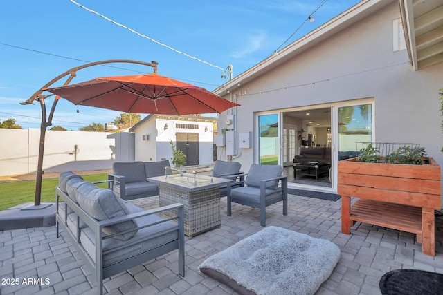 view of patio featuring fence, an outdoor living space, and an outdoor structure