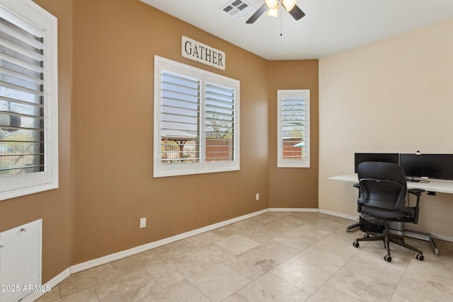 home office with visible vents, baseboards, and a ceiling fan