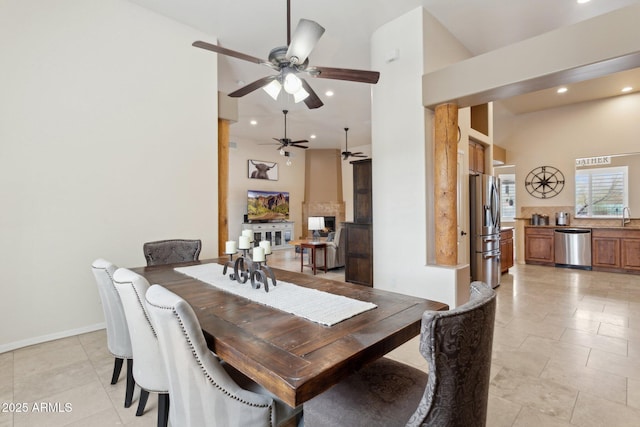 dining space featuring recessed lighting, baseboards, and light tile patterned flooring