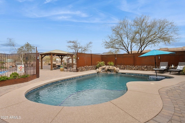 view of swimming pool with a gazebo, a fenced in pool, a patio, and a fenced backyard