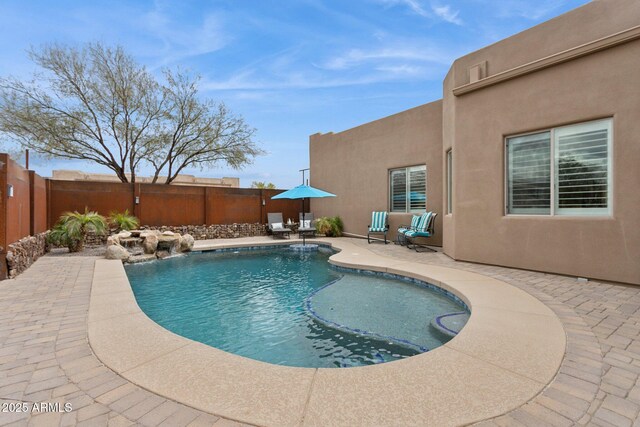 view of pool with a fenced in pool, a patio, and a fenced backyard