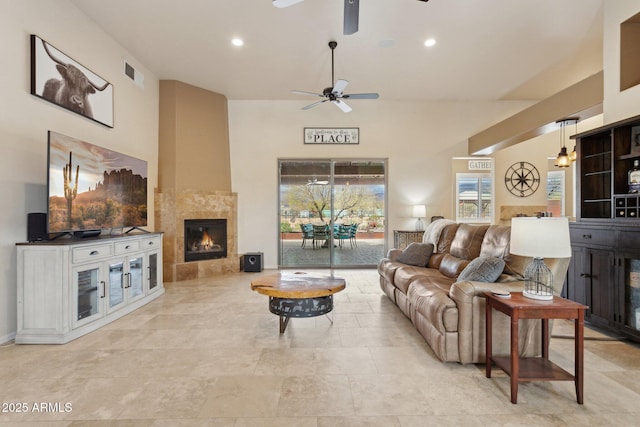 living room with recessed lighting, visible vents, ceiling fan, and a fireplace