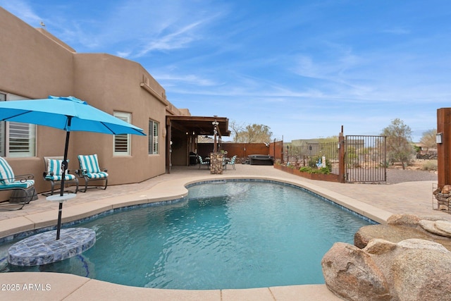 view of swimming pool with a patio area, a fenced in pool, a hot tub, and fence