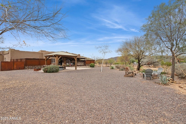 view of yard featuring a gazebo and fence