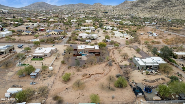 birds eye view of property with a mountain view