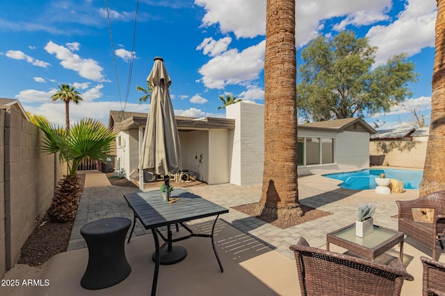 view of patio with a fenced in pool and a fenced backyard