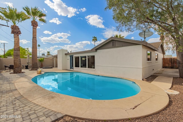 view of swimming pool featuring a fenced backyard, a fenced in pool, and a patio