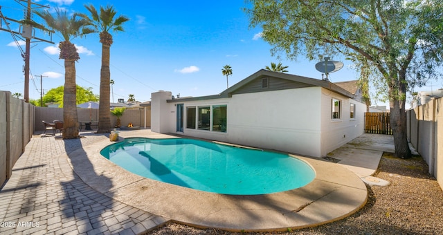 6907 E Portland St, Scottsdale, AZ 85257 - view of pool with a patio and a fenced backyard