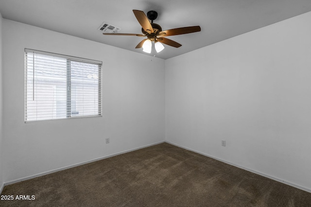 carpeted empty room featuring ceiling fan