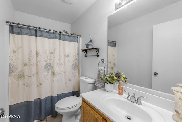 bathroom with a shower with curtain, vanity, and toilet