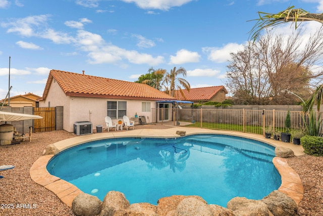 view of swimming pool featuring a patio area and central air condition unit