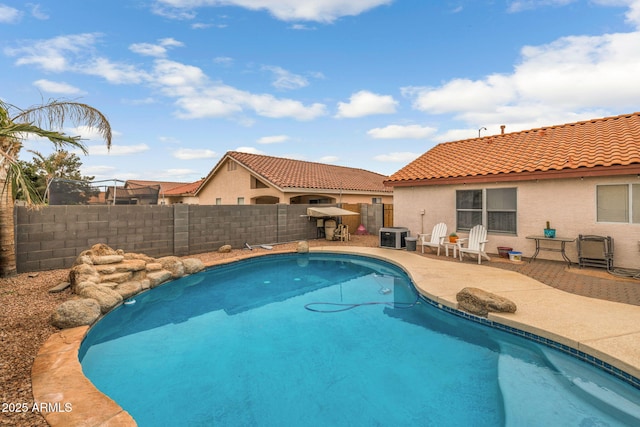 view of pool with central AC and a patio