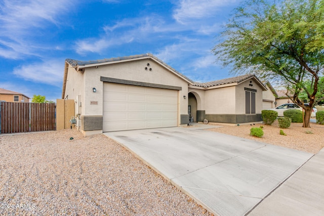 ranch-style home with a garage