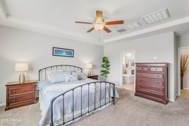 4229 W Magdalena Ln, Laveen, AZ 85339 - carpeted bedroom with baseboards, ceiling fan, a tray ceiling, and visible vents