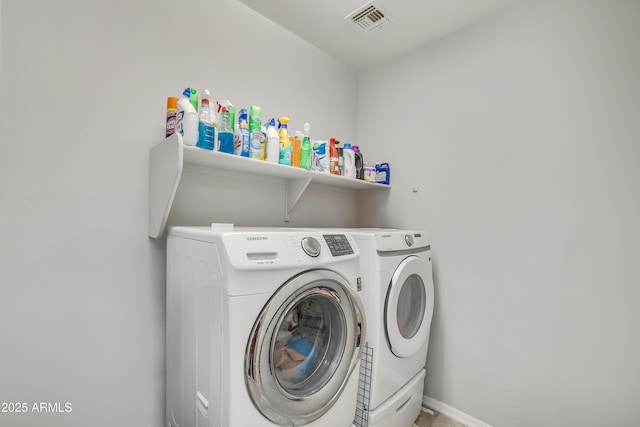 4229 W Magdalena Ln, Laveen, AZ 85339 - clothes washing area featuring visible vents, laundry area, and washing machine and clothes dryer