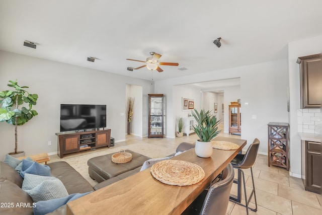 4229 W Magdalena Ln, Laveen, AZ 85339 - living room with a ceiling fan, baseboards, visible vents, and light tile patterned floors