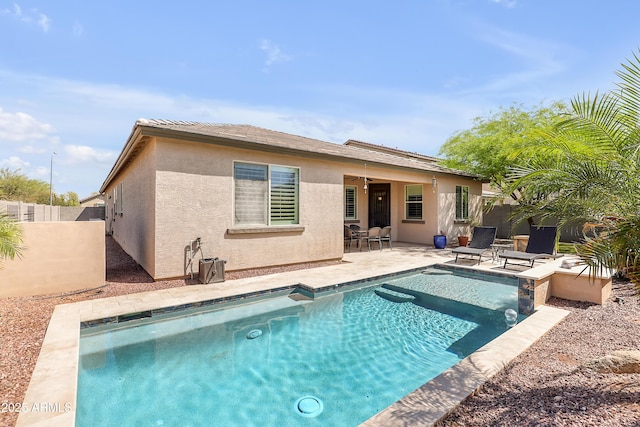 4229 W Magdalena Ln, Laveen, AZ 85339 - back of house featuring a patio, a fenced backyard, stucco siding, and a fenced in pool