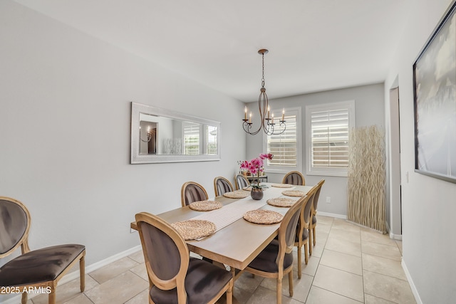 4229 W Magdalena Ln, Laveen, AZ 85339 - dining room with light tile patterned flooring, baseboards, and a chandelier