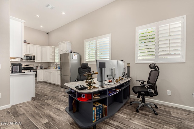 38415 N 25th Ave, Phoenix, AZ 85086 - home office featuring wood finished floors, a towering ceiling, and recessed lighting