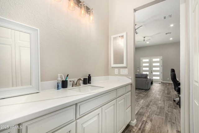 38415 N 25th Ave, Phoenix, AZ 85086 - bathroom with wood finished floors, french doors, and vanity
