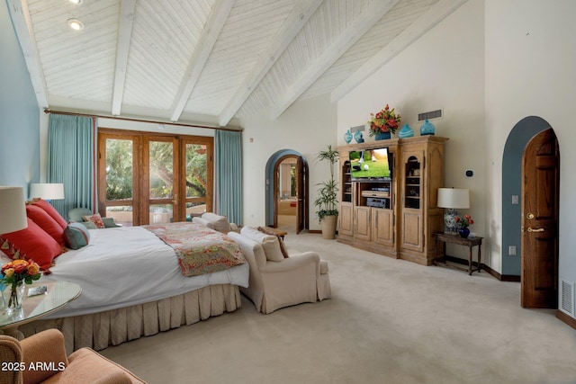 carpeted bedroom featuring visible vents, arched walkways, high vaulted ceiling, and beam ceiling