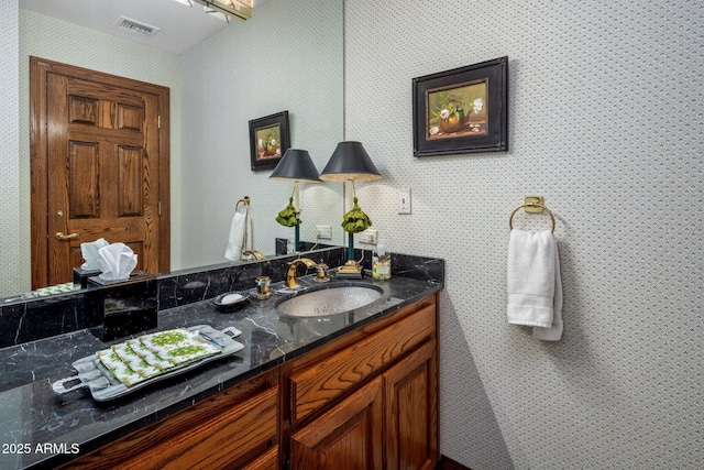 bathroom with vanity and visible vents