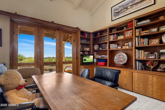 office with beam ceiling and light carpet