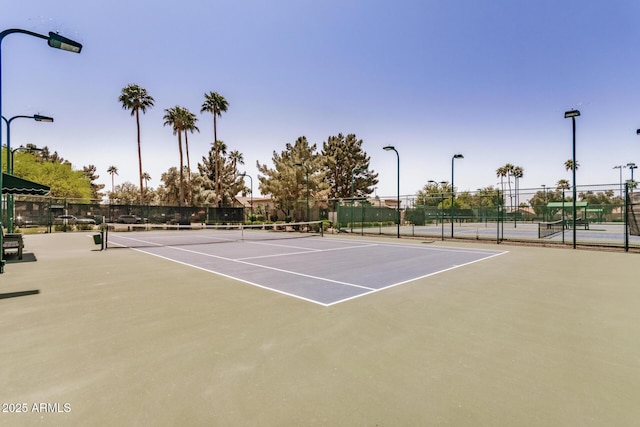 view of sport court with community basketball court and fence