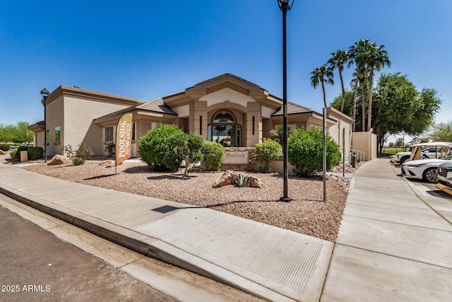 mediterranean / spanish house with stucco siding