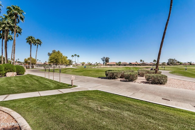 view of home's community featuring a residential view and a lawn