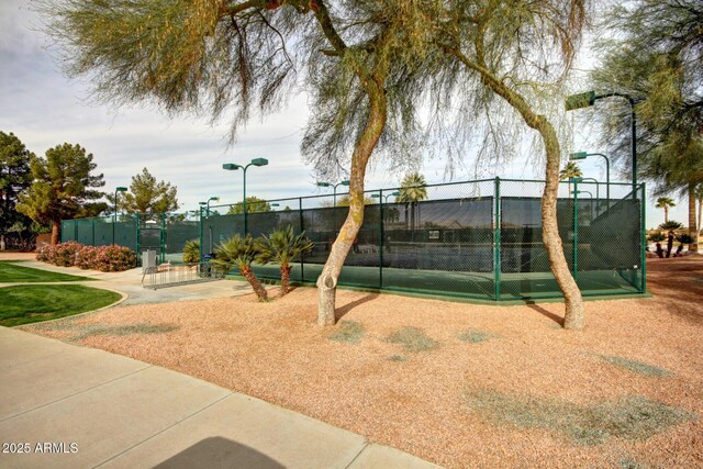 view of property's community with fence