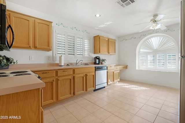 kitchen with visible vents, dishwasher, a sink, ceiling fan, and black microwave