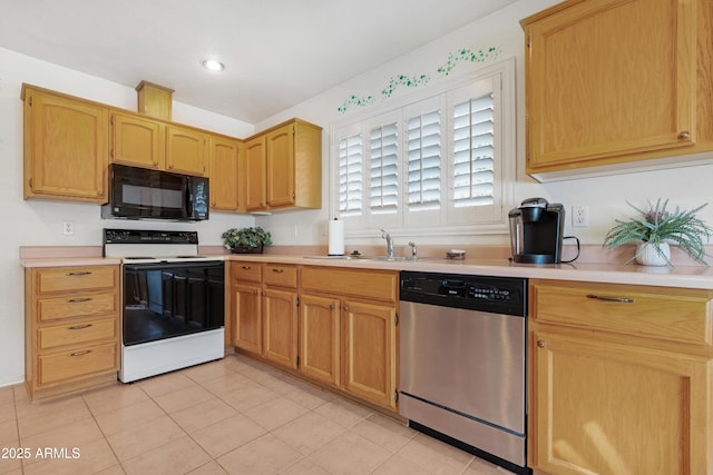 kitchen with electric range oven, a sink, light countertops, black microwave, and stainless steel dishwasher