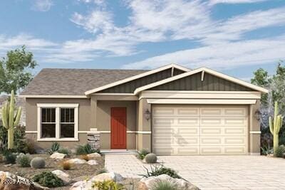 view of front of home with board and batten siding, decorative driveway, and an attached garage