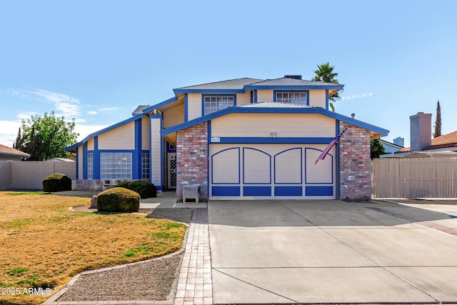 view of front of house with a garage and a front yard