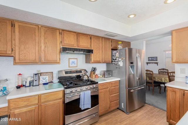 kitchen with stainless steel appliances and light wood-type flooring