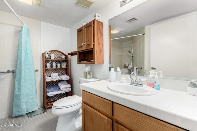 bathroom featuring tile patterned floors, vanity, toilet, and a shower with shower curtain