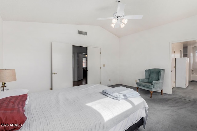 bedroom featuring ensuite bath, vaulted ceiling, ceiling fan, and carpet flooring