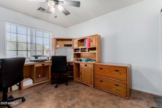 office with a textured ceiling and ceiling fan